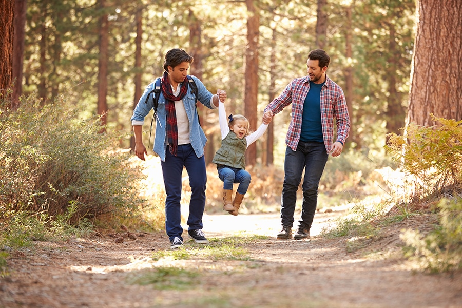 gay men walking with daughter